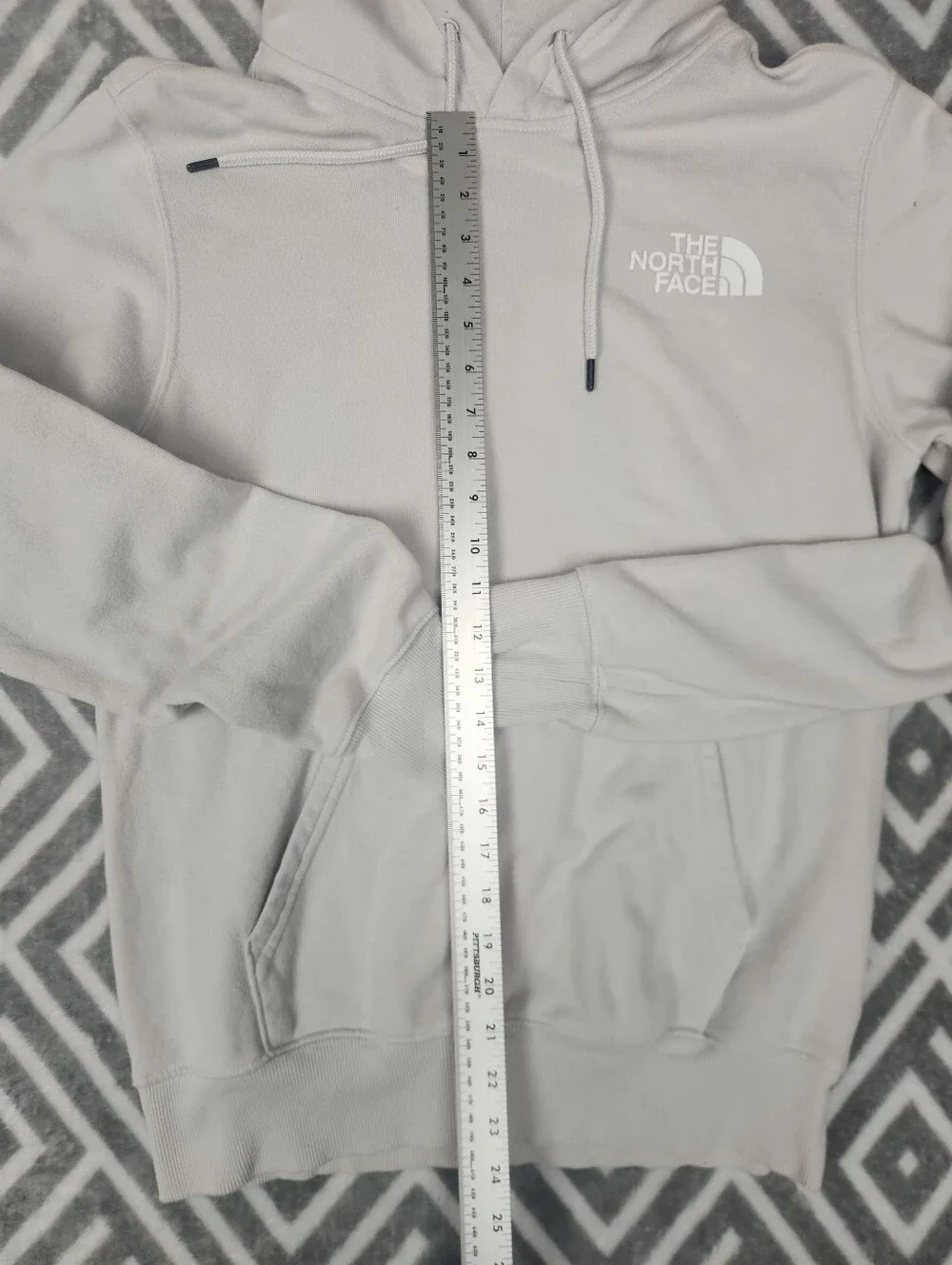 The North Face Never Stop Exploring Cream Hoodie with Blue & Purple Graphic
